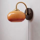 Detail of caramel glass shade meeting the brass fitter collar