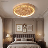Carved relief LED flush mount ceiling light in a styled interior
