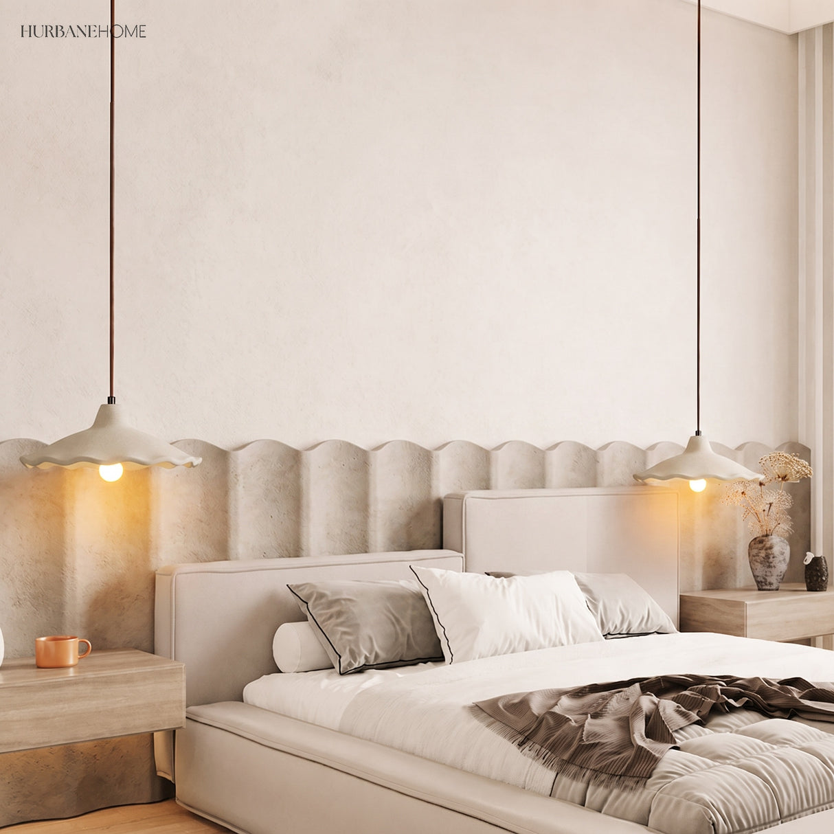 Two cement flower pendant lights flanking a bed in a warm bedroom