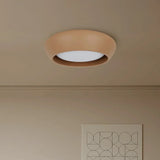 Rounded cement ceiling light displayed against a soft neutral studio backdrop
