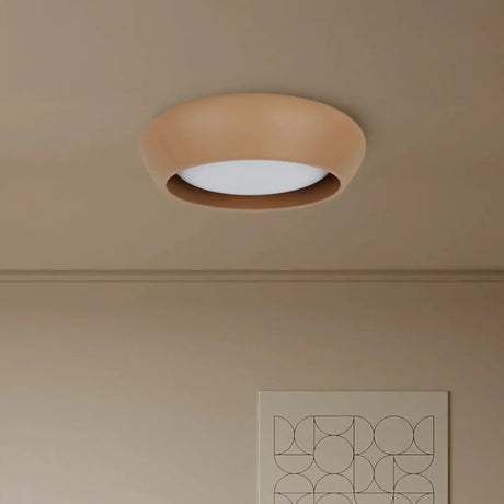 Rounded cement ceiling light displayed against a soft neutral studio backdrop