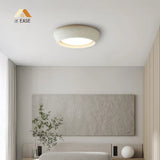 Low angle view of the domed flush mount light with warm downward illumination