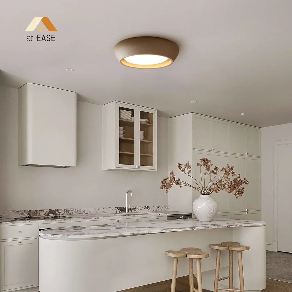 Overhead product shot of the round cement ceiling light and its lit centre
