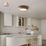 Overhead product shot of the round cement ceiling light and its lit centre