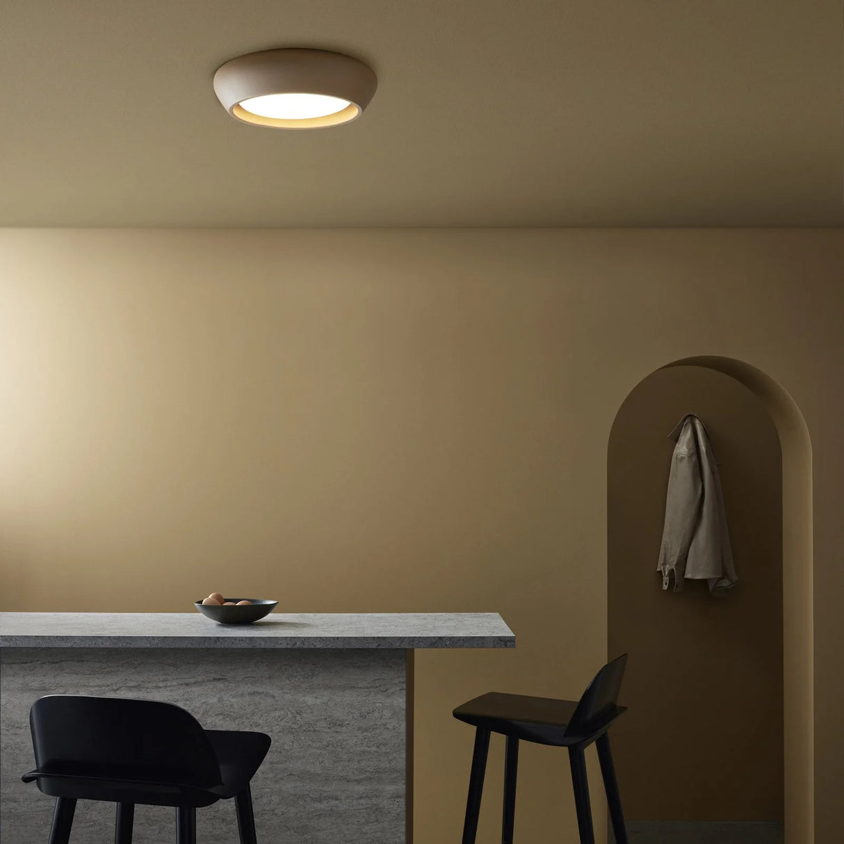 Warm room scene featuring the round flush mount ceiling light overhead