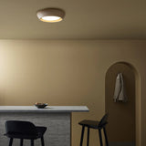 Warm room scene featuring the round flush mount ceiling light overhead