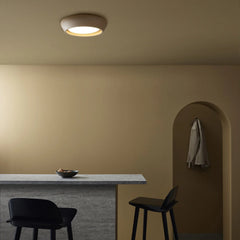 Warm room scene featuring the round flush mount ceiling light overhead