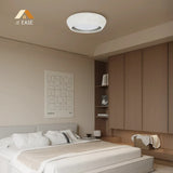 The low profile ceiling light shown installed above a minimalist seating area
