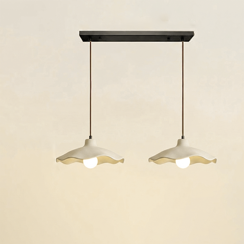 Two-light linear cement pendant fixture on a single black ceiling plate