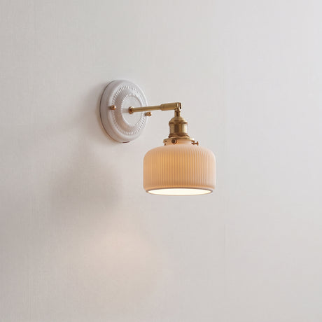 Ceramic shade and brass arm wall sconce, product photo