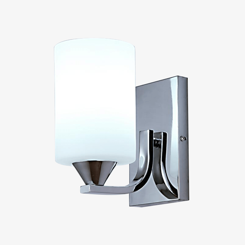 Single chrome wall sconce with a white cylinder glass shade on pale grey