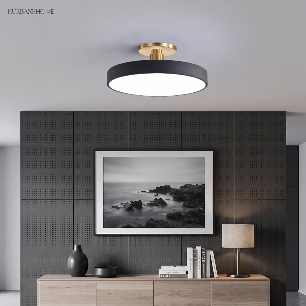 Circular ceiling light in a living room above a sideboard and artwork