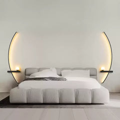 Minimalist wall light glowing softly in a clean grey bedroom