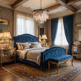 Clear crystal chandelier above a canopy bed in an elegant blue bedroom