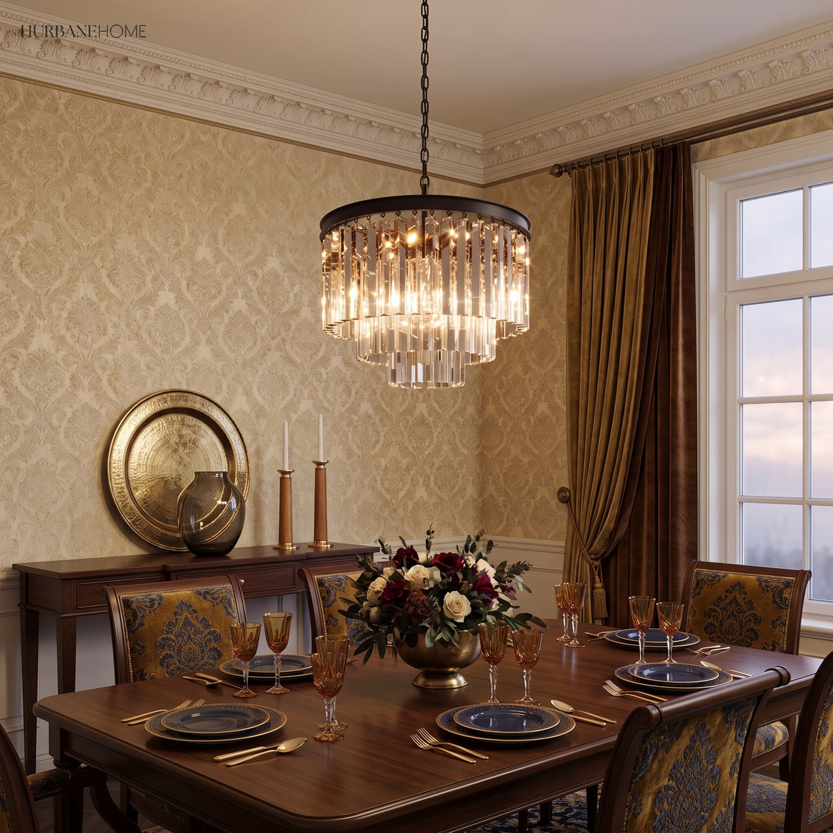 Clear crystal chandelier glowing over a formal dining table set for dinner
