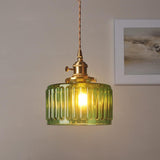 Fluted glass cylinder pendant shade on a brass holder and twisted cord