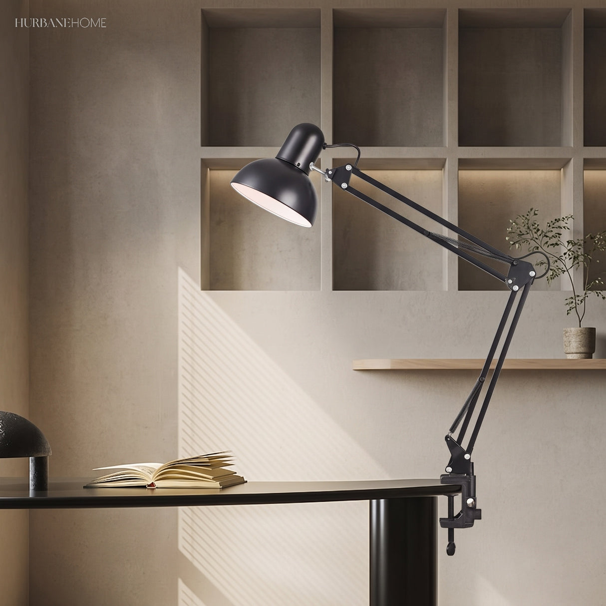 Retractable swing arm desk lamp angled over a desk surface