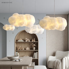 Cloud pendant light glowing softly in a cosy bedroom nook