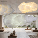 Cloud pendant light casting a warm glow in a living room