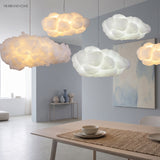 Cloud pendant light in a bright lounge with artwork