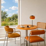 Side profile of the amber glass table lamp on a plain background