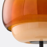 Detail shot of the glass shade edge and metal collar on the lamp
