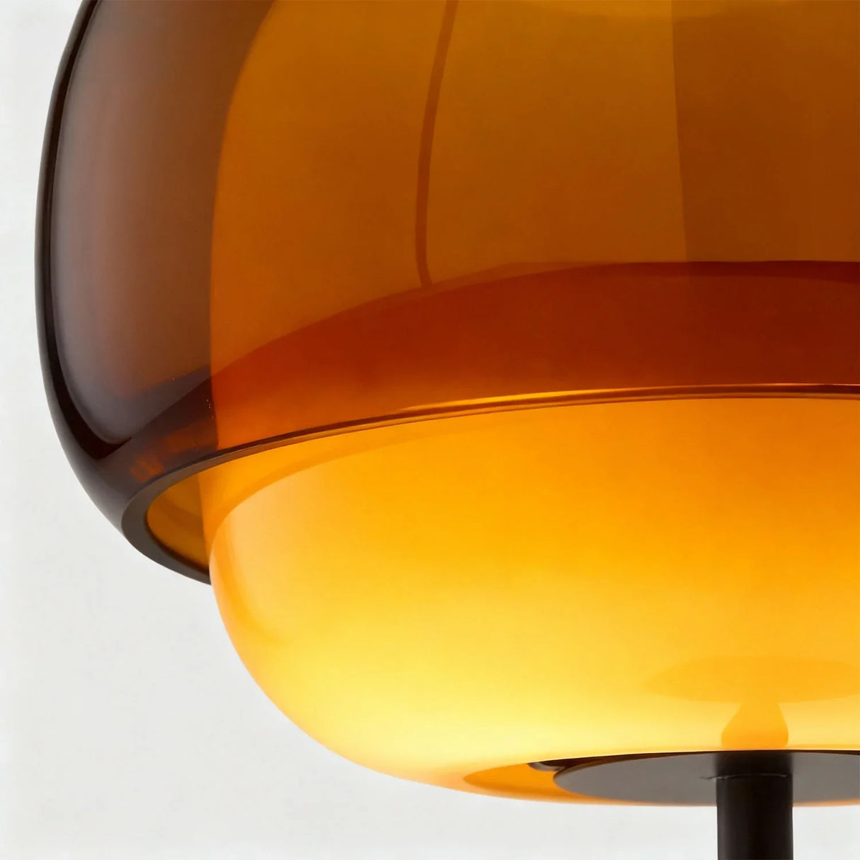 Close detail of the domed glass shade seam and metal fitting