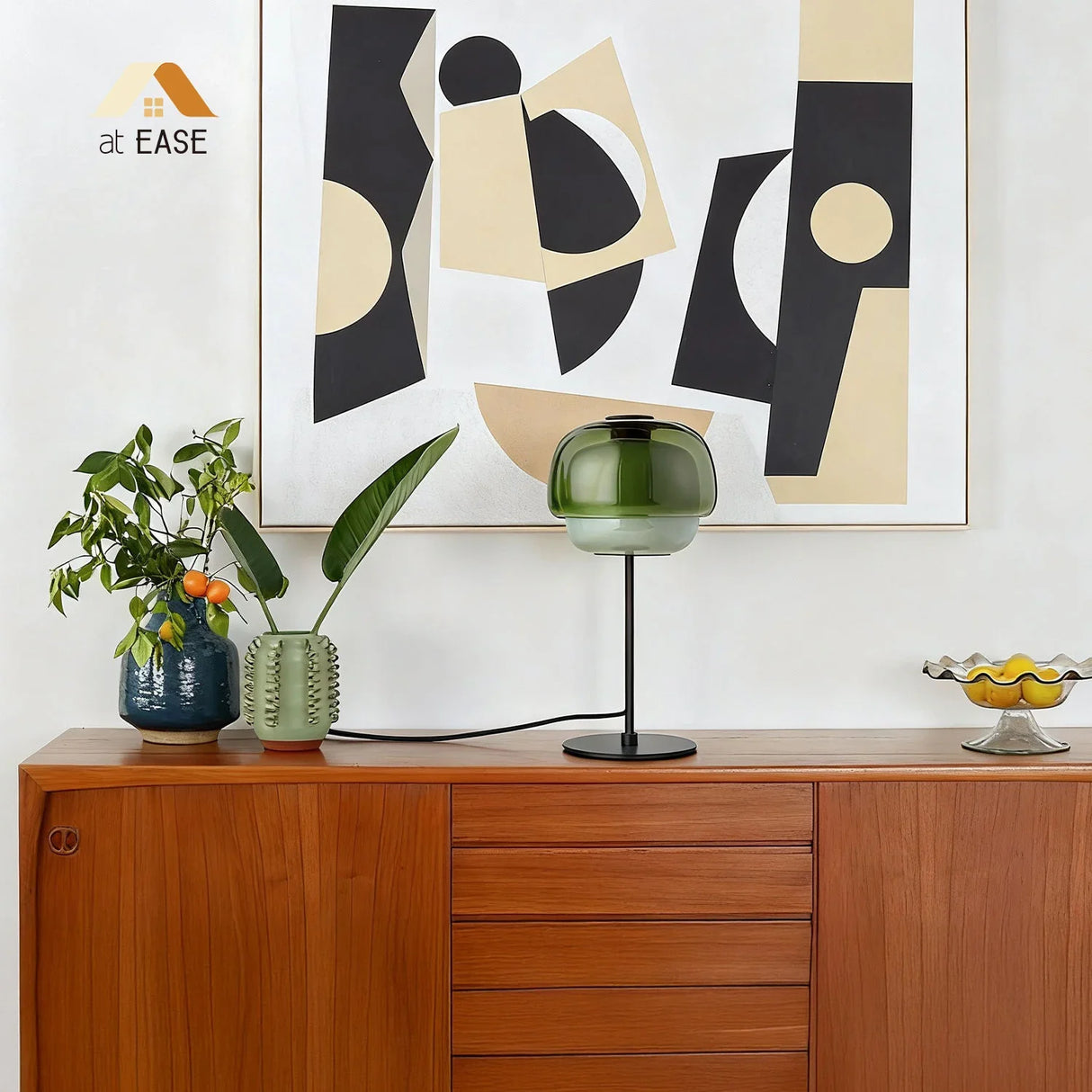 Domed glass table lamp in a warm tone with slim metal support