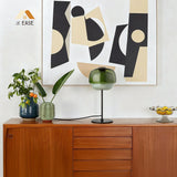 Domed glass table lamp in a warm tone with slim metal support