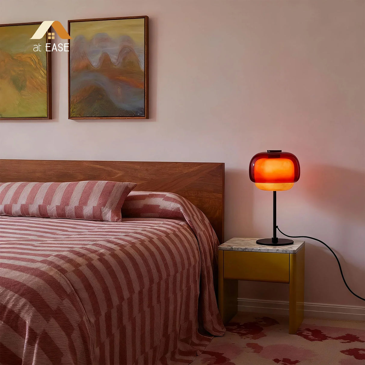 Colored glass dome table lamp lit to show the layered glass shade