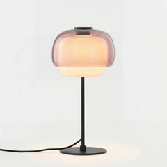 Colored glass domed table lamp shown against a plain studio background