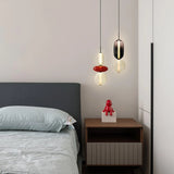 Modern pendant light showing black and smoke glass jar shapes