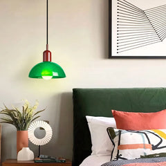 Colorful glass pendant light hung at height to show its dome shape