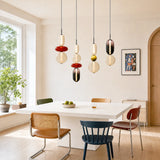 Colorful glass pendant light detail showing green and smoke toned jars