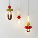 Modern stacked glass pendant light with rounded amber and white jars