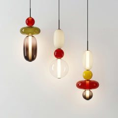 Modern stacked glass pendant light with rounded amber and white jars
