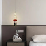 Modern glass pendant light design with elongated oval and disc jars
