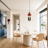 White globe and oval glass pendant light lit from within