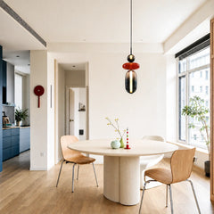 White globe and oval glass pendant light lit from within
