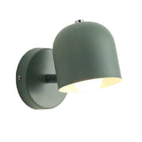 White macaron wall sconce on a plain grey studio background