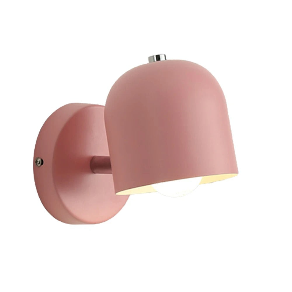 Yellow macaron wall sconce on a plain grey studio background