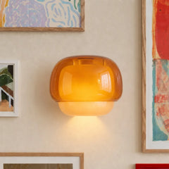 Coloured glass wall sconce viewed from a front angle unlit
