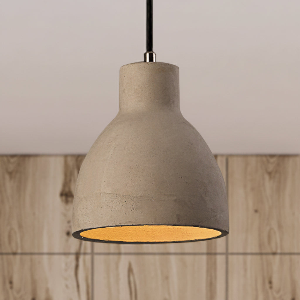 Cement barn pendant lit low over a timber counter and panelling