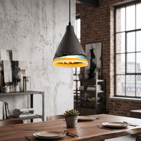 Cement cone pendant with a blue glazed rim above a timber table