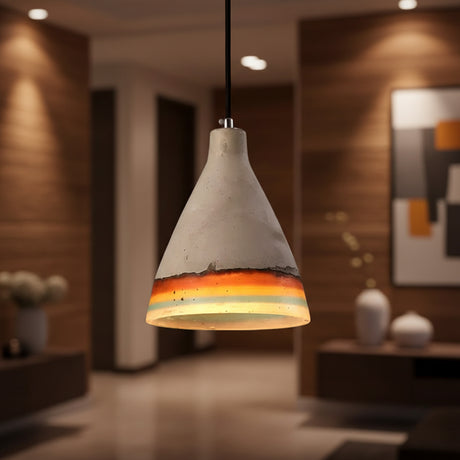 Cement cone pendant with an orange rim lit on a dark background