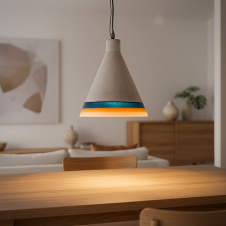 Cement cone pendant with a teal glazed rim lit on a dark background
