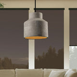 Cylinder cement pendant hanging by a window with a forest view