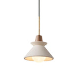 Small white cement cone pendant lit against a plain pale background