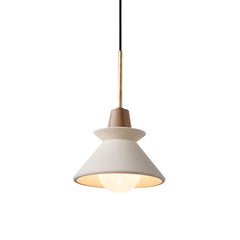 Small white cement cone pendant lit against a plain pale background