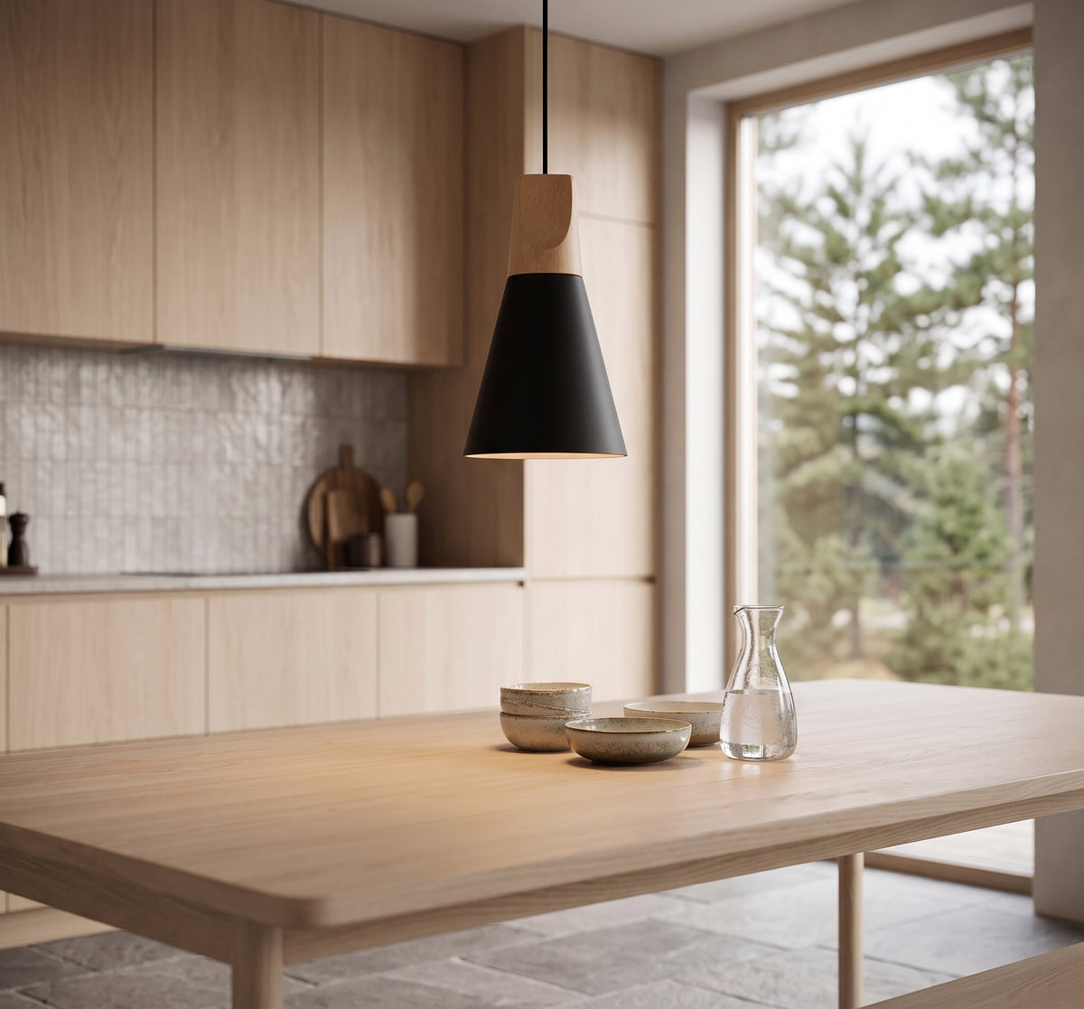 Black cone pendant with a wood top above a pale timber table